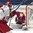 SPISSKA NOVA VES, SLOVAKIA - APRIL 23: Latvia's Niklavs Rauza #30 covers up the puck during relegation round action against Belarus at the 2017 IIHF Ice Hockey U18 World Championship. (Photo by Steve Kingsman/HHOF-IIHF Images)

